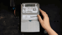 a hand is holding a meter that says activestream