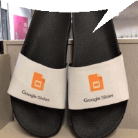 a pair of google slides sandals are sitting on a desk