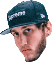 a man wearing a supreme hat looks at the camera