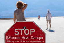 a stop sign that says extreme heat danger on it