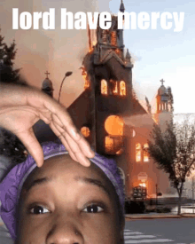 a picture of a burning church with the words " lord have mercy " above it