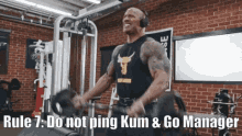 a man lifting weights in a gym with rule 7 do not ping kum & go manager written on the bottom