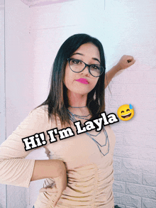 a woman wearing glasses says hi i 'm layla in black letters