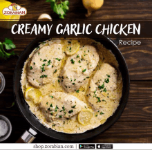 a recipe for creamy garlic chicken is on a wooden table