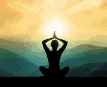 a silhouette of a person sitting in a lotus position in front of mountains