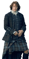 a man wearing a kilt and a jacket is standing with his hands on his hips