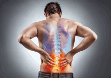 a man is holding his back in pain with a drawing of his spine behind him