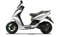 a white and black scooter with a green sticker on the back