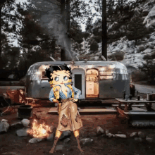 betty boop is standing in front of a trailer in the woods