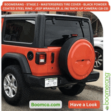 an orange jeep with a black tire cover and a license plate that says 851305