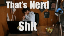 a person sitting in front of a laptop with the words that 's nerd shit written above them