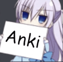 a girl with purple hair is holding a sign that says anki .