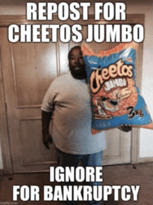 a man holding a bag of cheetos jumbo chips