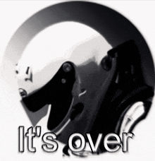 a black and white photo of a helmet with the words it 's over below it