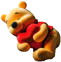 winnie the pooh is holding a red heart in his hands