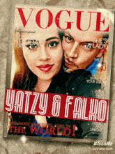 a vogue magazine with a picture of a woman and a man on the cover