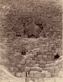 a black and white photo of a pyramid with the number 14 on the bottom right