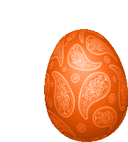 an orange easter egg with a paisley design on it