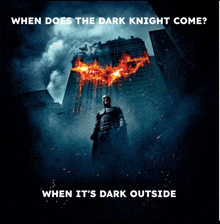 a movie poster for the dark knight shows batman standing in the dark