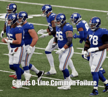 a group of new york giants football players walking on a field