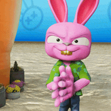 a pink cartoon bunny wearing a green shirt is clapping his hands