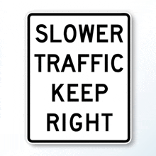 a sign that says " slower traffic keep right " on it