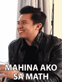 a man wearing a black leather jacket is smiling with the words mahina ako sa math written below him