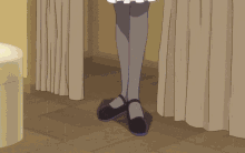 a woman in a maid costume is standing in a room