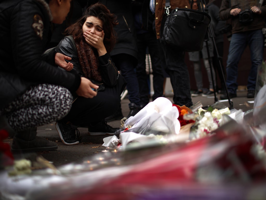 The Latest on the Paris Attacks: At Least 127 Dead, Including 8 Attackers