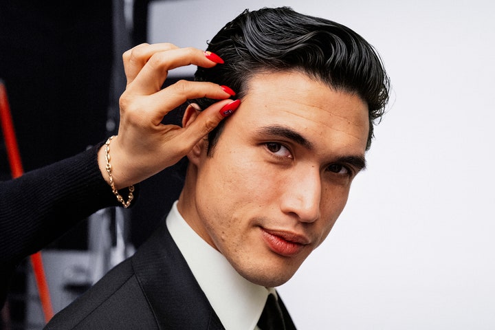 Charles Melton in a Richard James Savile Row suit and Charvet shirt and tie  behind the scenes at the 2024 Vanity Fair...