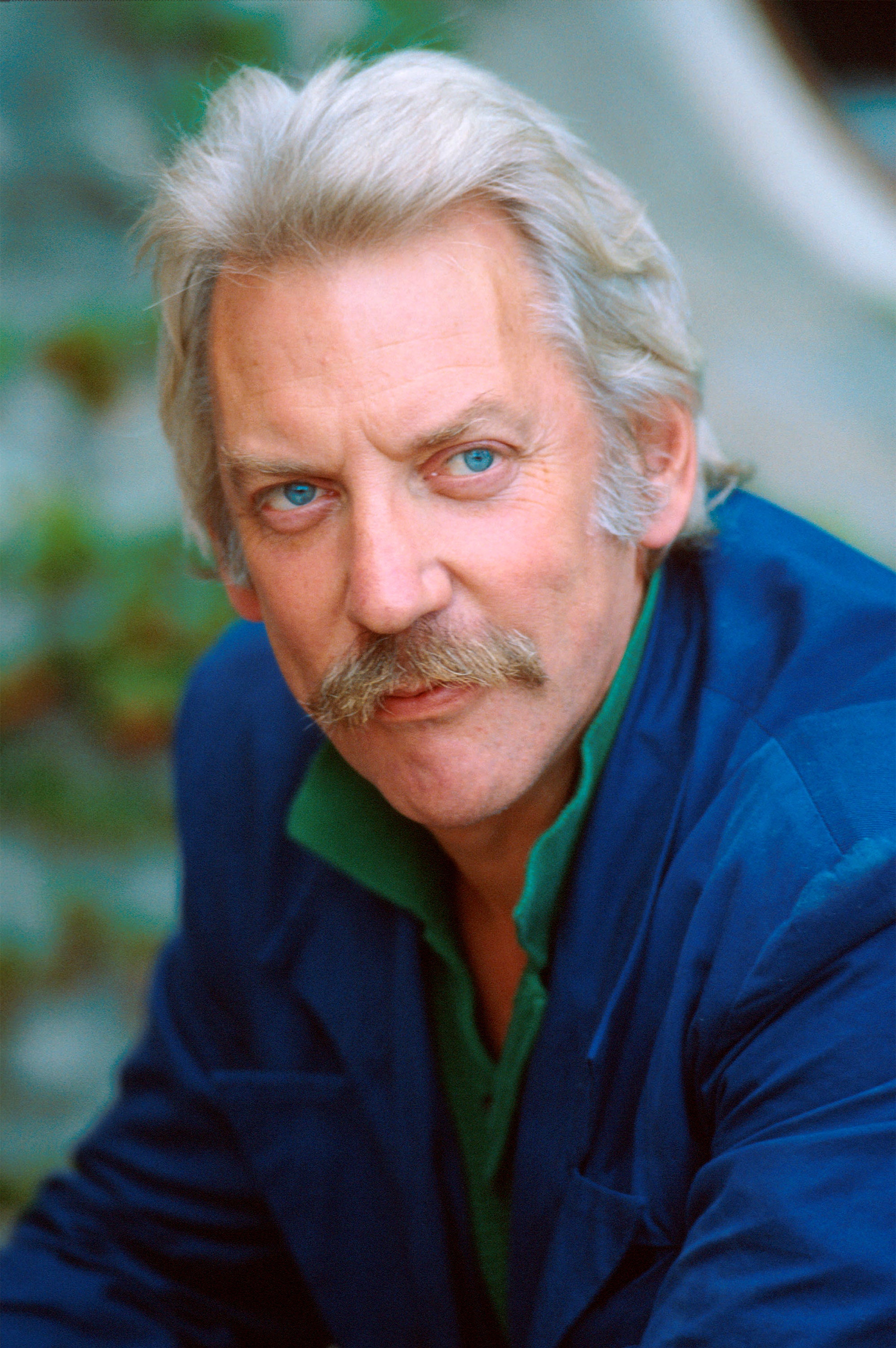 Image may contain Donald Sutherland Face Head Person Photography Portrait Blonde Hair Adult Clothing and Coat