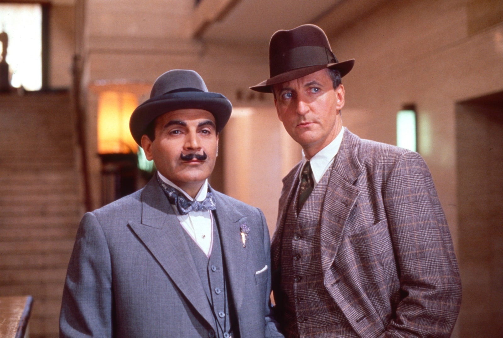 Image may contain David Suchet Hugh Fraser Blazer Clothing Coat Jacket Formal Wear Suit Hat Accessories and Tie