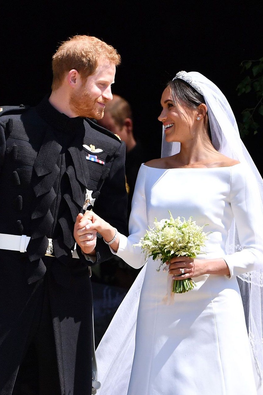 Image may contain Clothing Apparel Prince Harry Duke of Sussex Human Person Fashion Robe Gown and Wedding