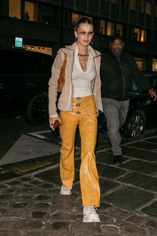 Image may contain Human Person Clothing Apparel Shoe Footwear Pants Bella Hadid Car Transportation and Vehicle