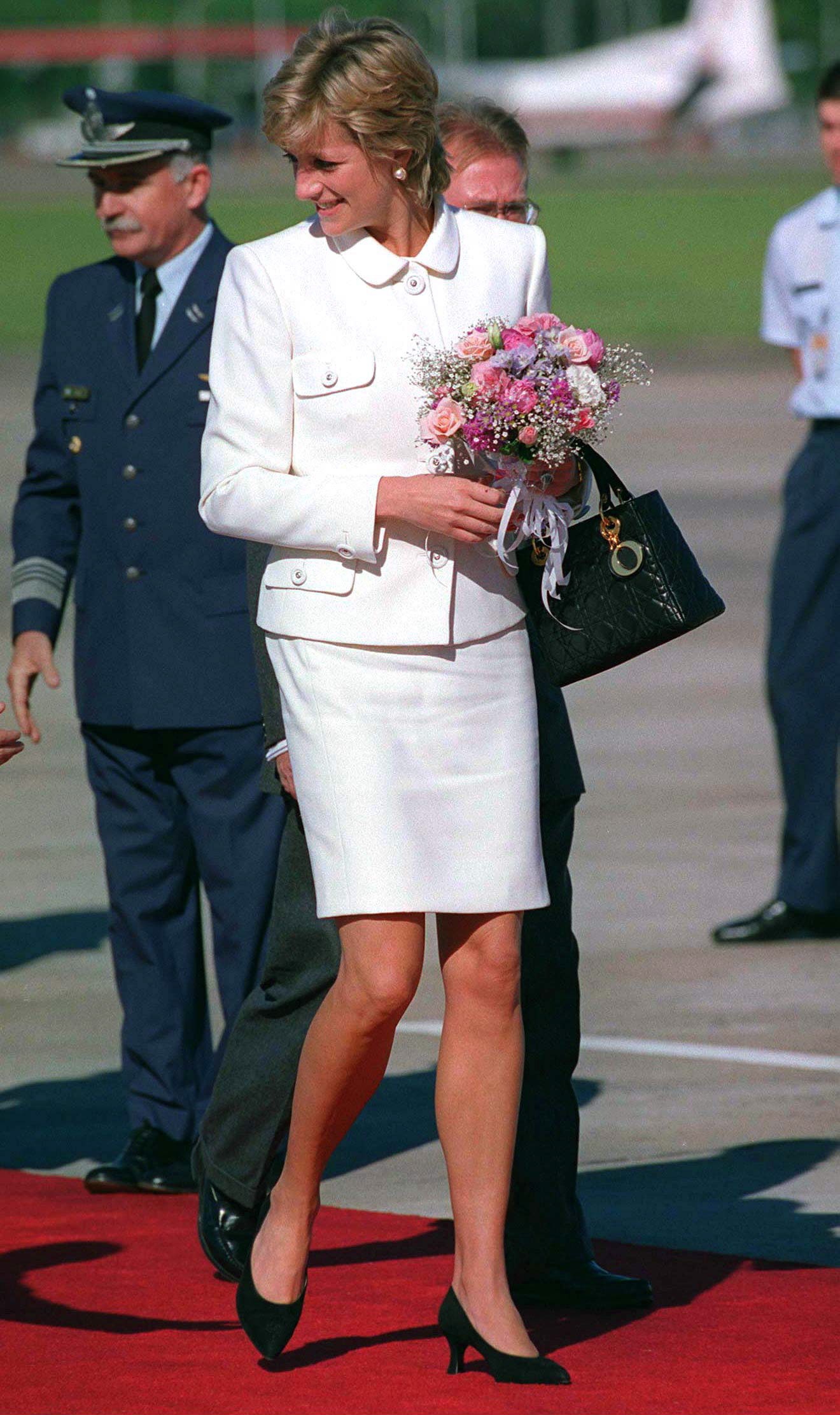 Image may contain Diana Princess of Wales Footwear Clothing Shoe Apparel Human Person Plant Flower and Blossom