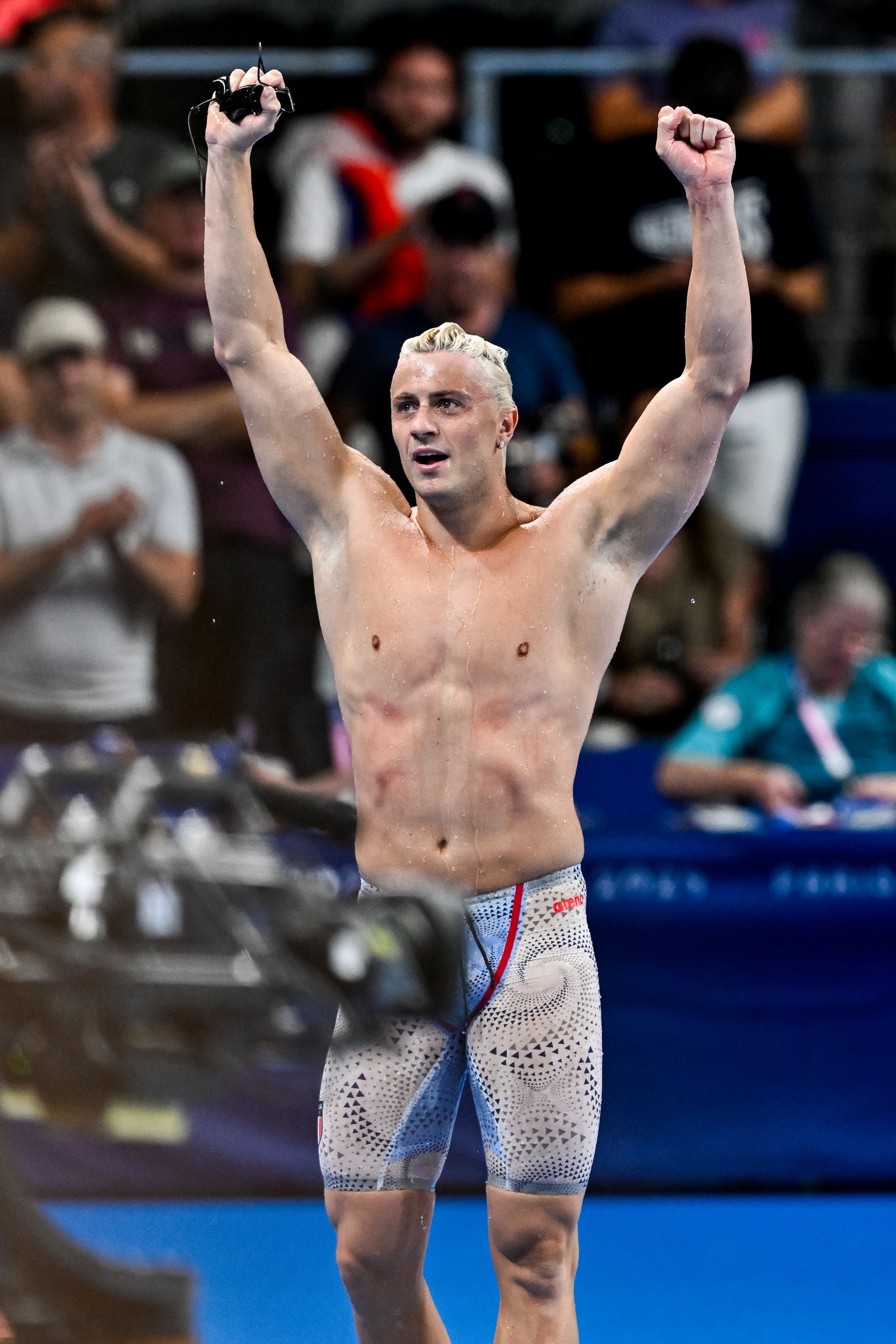 Nicolo Martinenghi of Italy celebrates after winning the gold medal in the swimming 100m Breaststroke Men Final during...