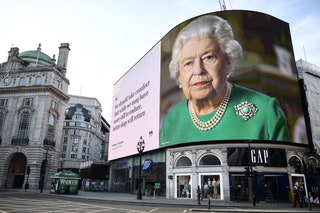 Image may contain Elizabeth II Human Person Advertisement Billboard and Road