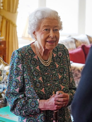 Image may contain Elizabeth II Human Person Senior Citizen Couch and Furniture