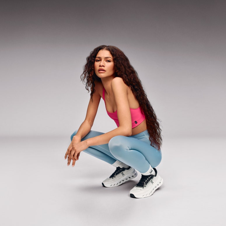 Image may contain: Zendaya, Clothing, Footwear, Shoe, Person, Teen, Sitting, Fitness, Sport, Squat, Working Out, and Sneaker