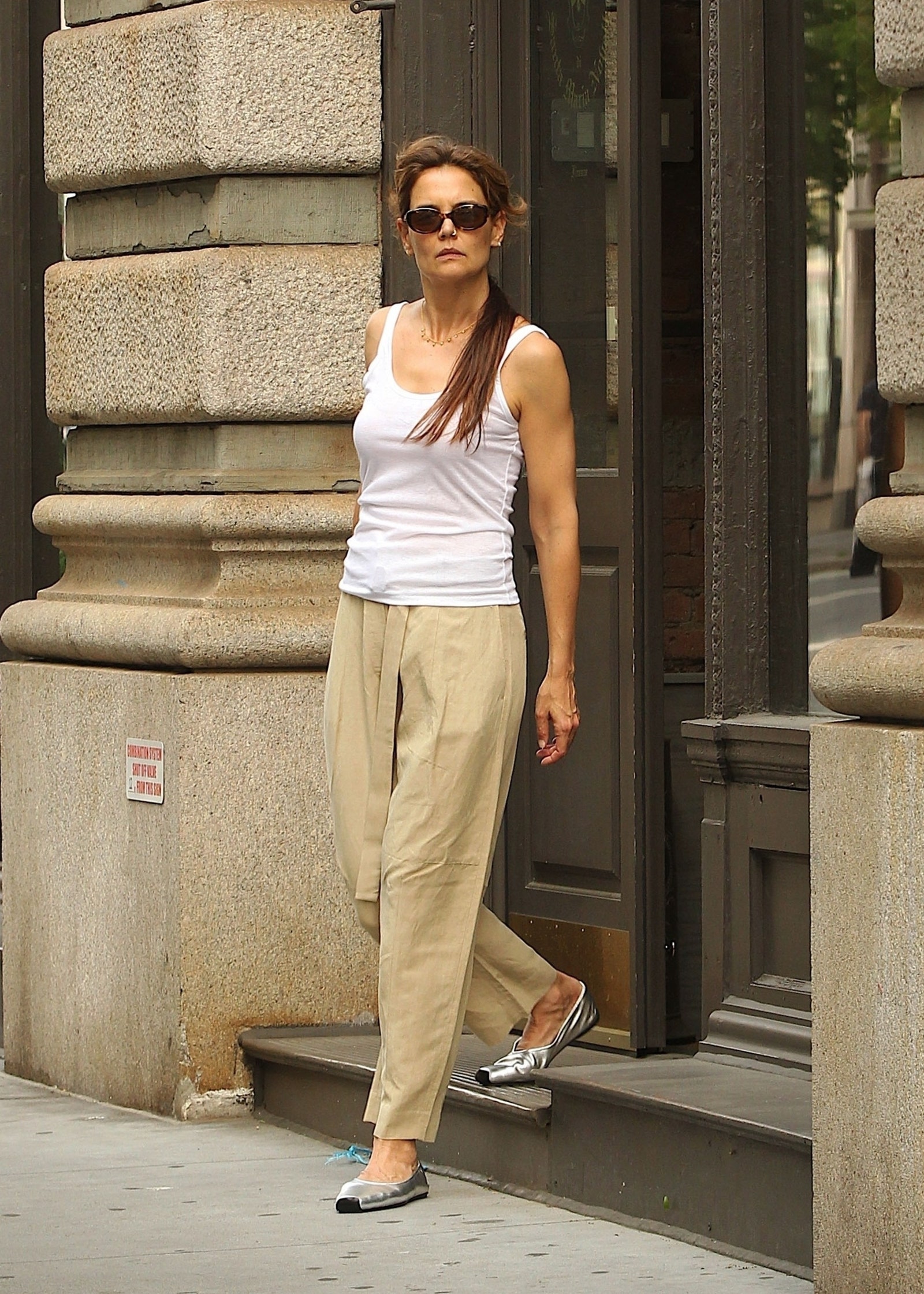 Image may contain Katie Holmes Clothing Pants Accessories Glasses Footwear Shoe Adult Person Jewelry and Necklace