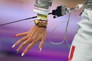 France's Sara Balzer competes with nails blue white and red to the colours of the French flag against Turkey's Nisanur...