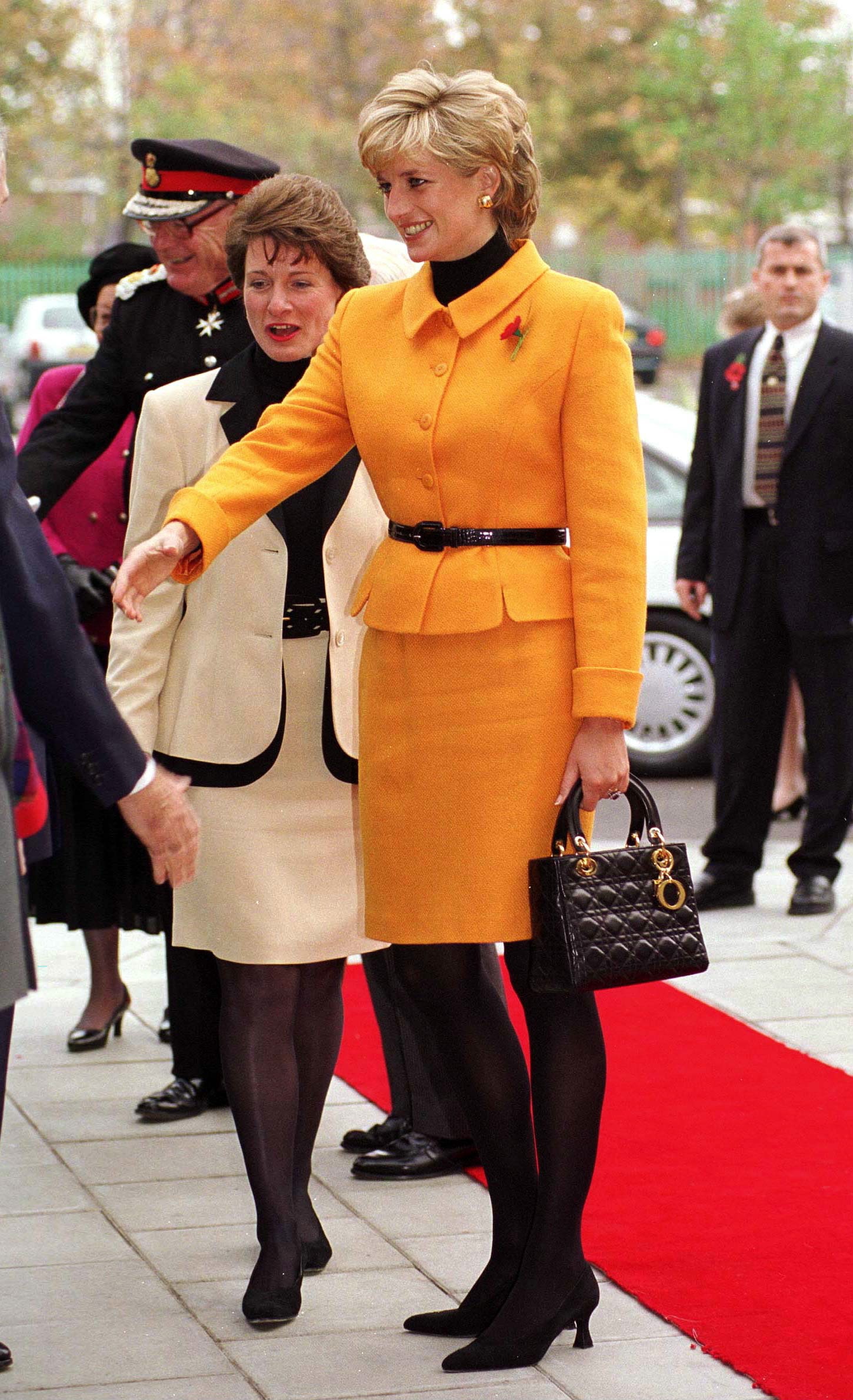 LIVERPOOL UNITED KINGDOM  NOVEMBER 07 Princess Diana Visiting Liverpool. Diana Is Wearing A Bright Orange Suit Designed...