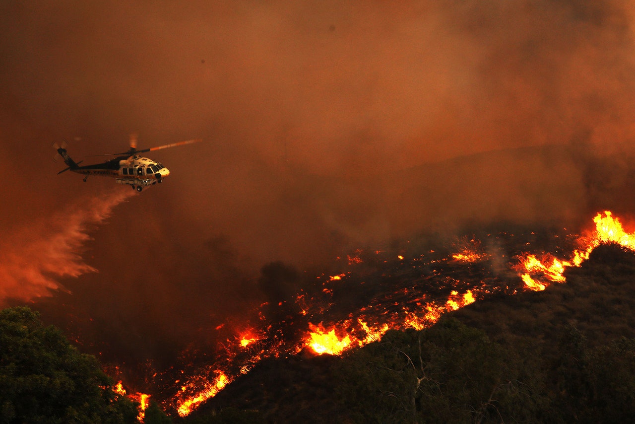 The Daring Art of a Helicopter Wildfire Rescue