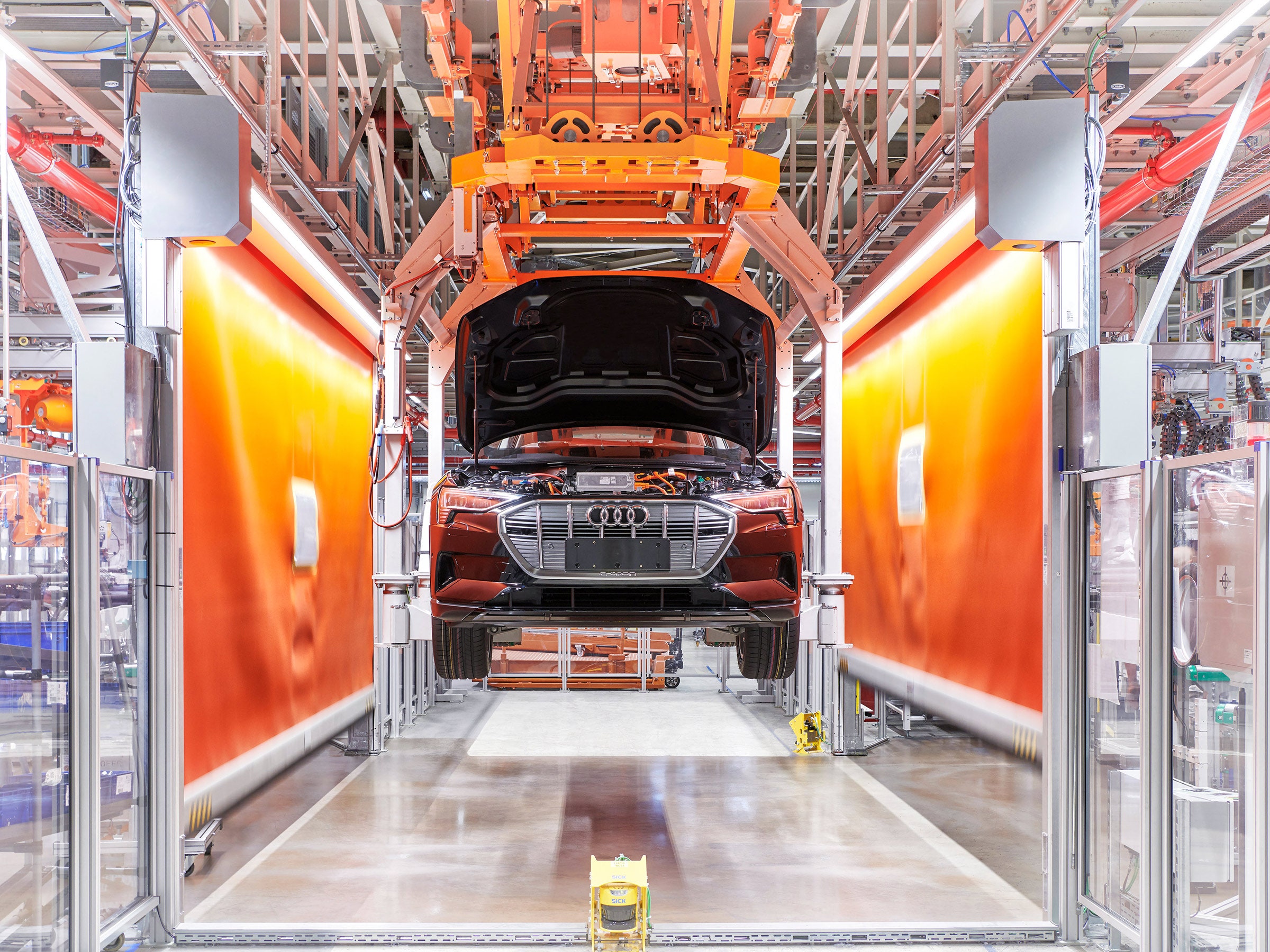 view of audi factory showing a car lifted up