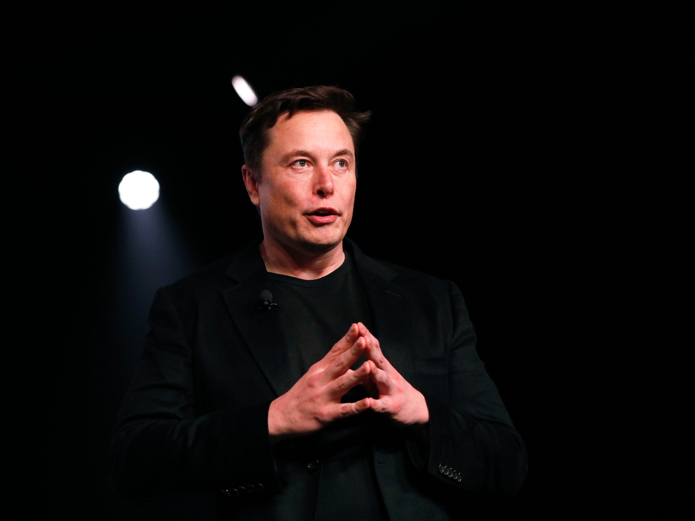 elon musk onstage speaks