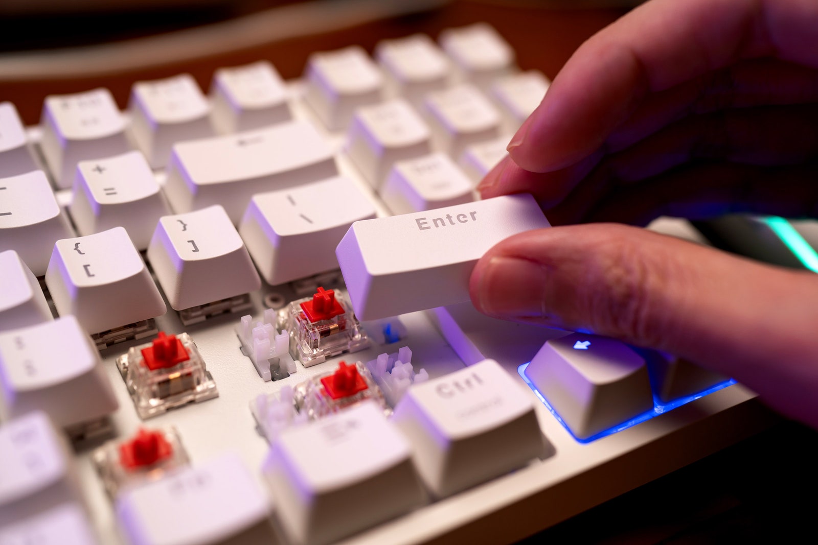 Person removing keys from a keyboard