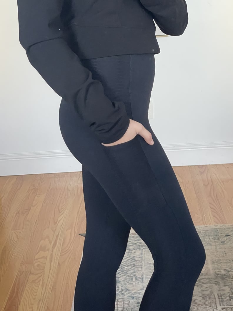 Woman wearing Booty by Brabants pocket leggings with a hand in her pocket.