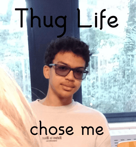 a picture of a young man with glasses and the words thug life chose me