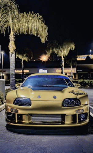 a yellow sports car is parked in front of a store called pepsi