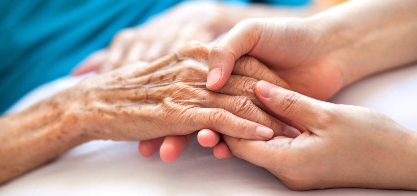 Close up of two people holding hands